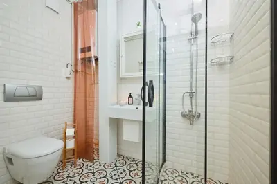 a bathroom with a shower and a toilet and a sink at Stunning 2BR 1 Min Metro&Galata in Istanbul