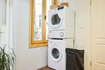 a washing machine and a washer in a room at Stunning 2BR 1 Min Metro&Galata in Istanbul
