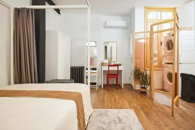 a bedroom with a bed and a desk with a table at Modern 2BR Apt Galata-Taksim Area Near Metro in Istanbul