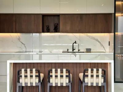 a kitchen with a counter with a sink and some chairs at Beykoz Breeze in Beykoz