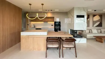 a kitchen with a table and some chairs in a room at Beykoz Breeze in Beykoz