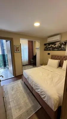 a bedroom with a large white bed in it at Albatros suite in Istanbul