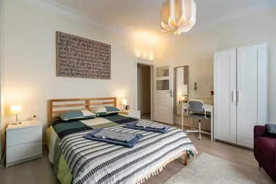 a bedroom with a bed and a desk in a room at sevim suites Nişantaşı Center in Istanbul