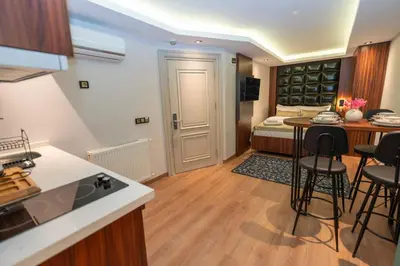 a kitchen and a living room with a bedroom at THE MUA LUXURY HOMEs in Istanbul