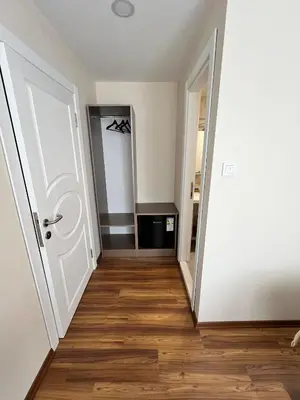 an empty room with a door and wooden floors at Nacre 360 in Istanbul