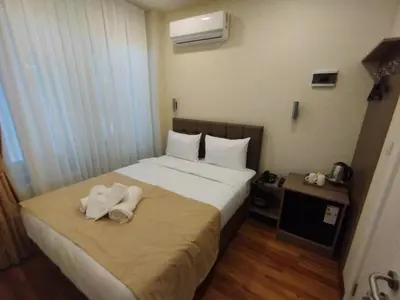 a hotel room with a bed with towels on it at Nacre 360 in Istanbul