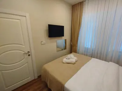 a hotel room with a bed with towels on it at Nacre 360 in Istanbul