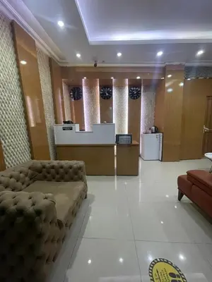 a waiting room with a couch and a counter at Kıyı Butik Otel in Mimarsinan