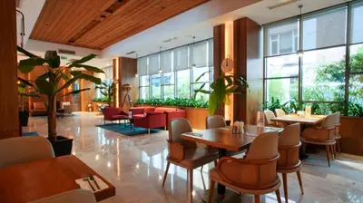 a restaurant with tables and chairs and windows at Dosso Dossi Hotels & SPA Downtown in Istanbul