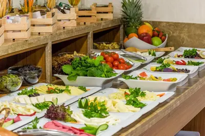 a buffet with many plates of food on a table at Bizim Hotel in Istanbul