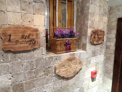 a brick wall with signs on the side of a building at Istanberry - Pera Apartments in Istanbul