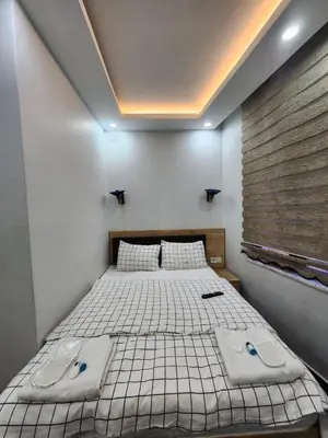 a bedroom with a bed with two towels on it at Acet Residence in Istanbul