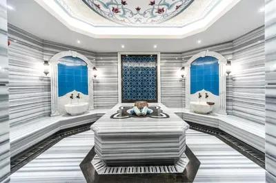 a bathroom with two sinks and a large bed at Arcade Hotel & SPA Nisantasi in Istanbul