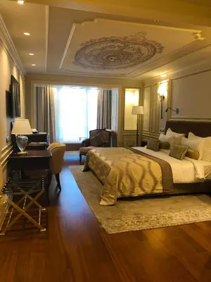 a bedroom with a bed and a desk and a piano at Arcade Hotel & SPA Nisantasi in Istanbul