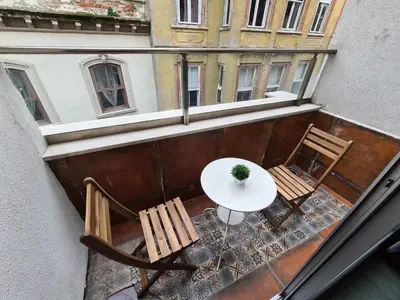 an overhead view of a table and chairs on a balcony at Excellent Apartments Galata in Istanbul