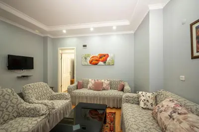 a living room with two couches and a tv at TAKSIM SUITE Apartment in Istanbul