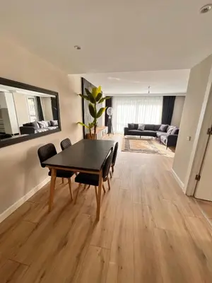 a living room with a table and a couch at Sense Suite Residence-19 in Istanbul