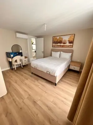 a bedroom with a bed and a desk in it at Sense Suite Residence-19 in Istanbul