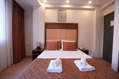 a bedroom with a bed with two white towels on it at Keeper in Istanbul