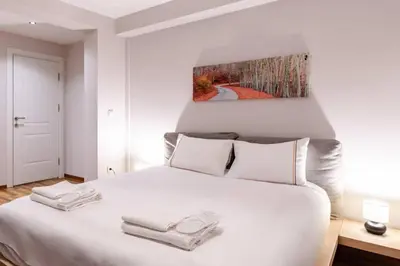a bedroom with a white bed with two towels on it at Cute Private Garden 2BD2Bath Quaint Home! #366 in Istanbul