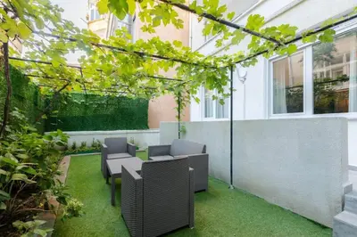 an outdoor patio with chairs and a table at Cute Private Garden 2BD2Bath Quaint Home! #366 in Istanbul