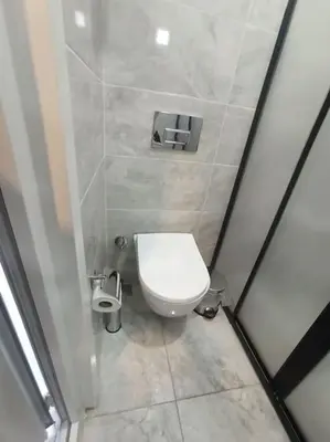 a small bathroom with a toilet in a stall at Özdemir Apart - Sultanahmet in Istanbul