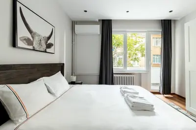 a bedroom with a large white bed and a window at Bright Charming Modern 3BD2Bath Balcony! #367 in Istanbul
