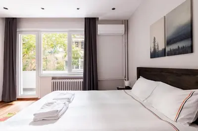 a bedroom with a large white bed with a window at Bright Charming Modern 3BD2Bath Balcony! #367 in Istanbul