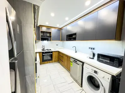 a kitchen with a washer and dryer in it at Sisli apartment 6 4 4 in Istanbul