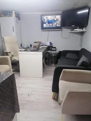 a living room with couches and a tv on the wall at opera wall suite in Istanbul