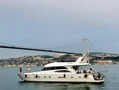 a boat in the water with a bridge in the background at Luxury Yachts Istanbul in Istanbul