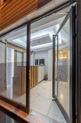 a sliding glass door in a room with a kitchen at Beys Hotel Suites in Istanbul