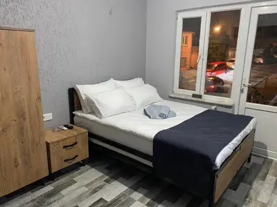 a small bedroom with a bed and a window at Pamir Butik Otel in Bursa