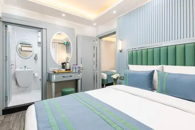 a hotel room with a bed and a bathroom at Santa Rio Gold Taxim Hotel in Istanbul