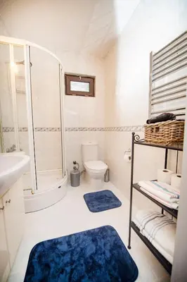 a bathroom with a shower toilet and a sink at A Cozy, Quiet Home with Great View in City Center in Istanbul