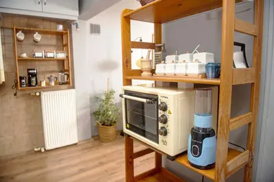 a kitchen with a microwave on a shelf at A Cozy, Quiet Home with Great View in City Center in Istanbul