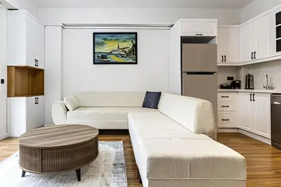 a living room with a white couch and a coffee table at NIŞANTAŞI JANTY LUXURY, 4 NEW APARTMENTs in Istanbul
