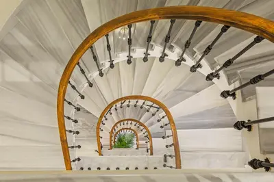 a spiral staircase in a house at Meroddi Bağdatlıyan - 1892 Heritage Rooms by Galata Tower in Istanbul