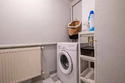 a small laundry room with a washer and dryer at Spacious Dublex in Cihangir in Istanbul