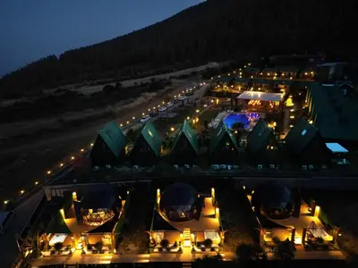 a view of a building with lights at night at Bisanthe Panorama in Kumbağ