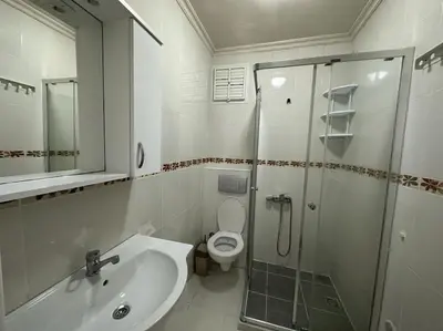 a bathroom with a shower and a toilet and a sink at Şişli mado 9 2 3 in Istanbul
