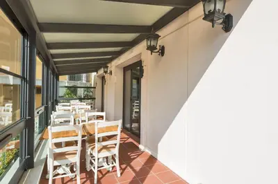 a patio with a table and chairs on a balcony at Hanna Hotel in Istanbul
