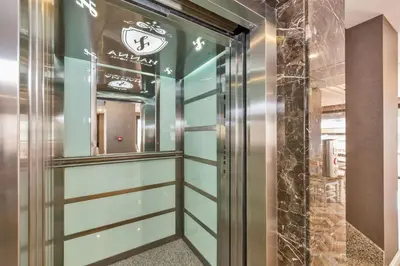 a elevator in a building with a sign on the wall at Hanna Hotel in Istanbul