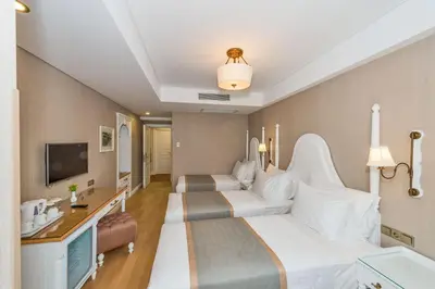 a hotel room with two beds and a television at Hanna Hotel in Istanbul
