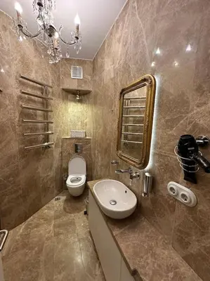 a bathroom with a toilet and a sink and a mirror at Doctors Spacious Place in Istanbul