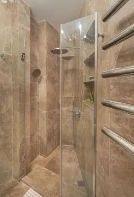 a shower with a glass door in a bathroom at Doctors Spacious Place in Istanbul