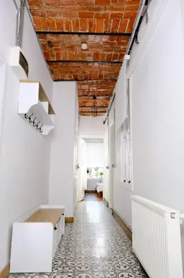 a room with white walls and a wooden ceiling at Historical Flat in Galata - Tatar Beyi Street - TRA 2026 Award-Winner in Istanbul