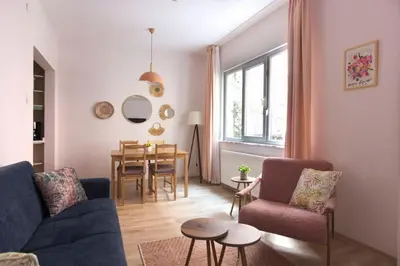 a living room with a couch and chairs and a table at Soft modern inspiring flat in the center of Moda in Istanbul