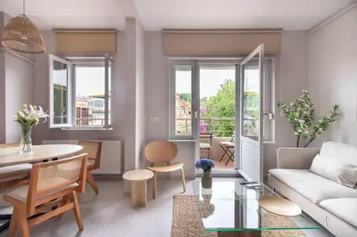 a living room with a couch and a table at 2BR House W Island Charm in Adalar
