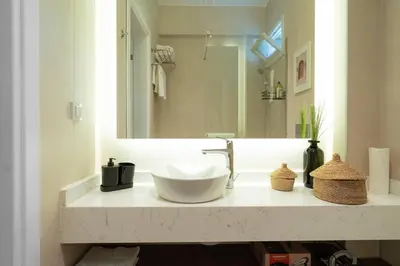 a bathroom with a sink and a large mirror at Designed and Modern 2BR Flat In Center Of Buyukada in Adalar